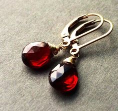 Genuine Garnet earnings, burgundy gold dangles, dark red teardrop jewelry, January birthstone.  Handcrafted with natural red Garnet Stones.  Petite, minimalistic and lightweight.  Real Untreated Garnet stones (8 x 6 mm) faceted teardrop shape gems wire wrapped and suspended on leverbacks.  Length is about 1" long.  Each pair of gems is unique and one of a kind, they are untreated and natural stones, expect some imperfections. These beautiful earrings will be a nice gift for a female that like mo Gold Garnet Teardrop Earrings, Gold Teardrop Garnet Earrings, Red Garnet Dangle Earrings, Faceted Teardrop Red Jewelry, Garnet Drop Jewelry For Gift, Red Garnet Teardrop Earrings, Red Teardrop Garnet Earrings, Gift Garnet Drop Jewelry, Classic Red Teardrop Pendant Jewelry