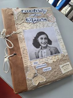 a book with an image of a woman on the front cover and some string attached to it