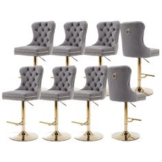 six grey velvet bar stools with gold legs