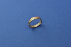 So Long, Lonesome. Posy ring in raw brass. Posy rings were especially popular in England and France from the late medieval period onwards. They can be recognized through the engraved words on them, most commonly on the inner surface of the rings to keep messages private and close to the wearer. This ring celebrates loneliness because there is no shame to lead a single life! The ring is in raw brass. It can oxidize over time, leave traces on the finger or brighten up depending on your skin's pH. It is a normal non-toxic process, as the jewel ages with you! The technique used is the traditional lost wax casting: I sculpt a prototype in a hard wax, then give it to the foundry to get it cast in brass. I finish with polishing. If you have any question on the size chart, please let me know. The Brass Engraved Promise Ring, Symbolic Brass Engraved Ring For Anniversary, Vintage Gold Engraved Promise Ring, Engraved Brass Promise Ring, Vintage Stamped Engraved Promise Ring, Engraved Brass Ring For Promise, Engraved Byzantine Ring For Anniversary, Brass Engraved Ring For Promise, Symbolic Engraved Brass Ring For Anniversary