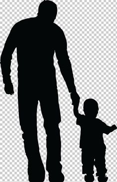 a silhouette of a man holding the hand of a small child's hand, while standing