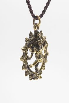 Size: ≈ 1.2"x 1.2"x 0.2" Material:Brass -- Shiva Nataraja Pendant Lord Shiva as the cosmic dancer or Nataraja. Shiva's dance is the dance of creation and destruction. Handcrafted with care in Thailand Size: ≈ 1.2"x 1.2"x 0.2" inches Material: Brass comes with a ≈ 24" inch brown fabric necklace Symbolic Jewelry For Navratri Rituals, Symbolic Jewelry For Navratri Puja, Symbolic Jewelry For Puja And Navratri, Symbolic Bronze Festival Jewelry, Symbolic Bronze Jewelry For Festivals, Symbolic Ceremonial Jewelry For Festivals, Symbolic Jewelry For Puja And Festivals, Symbolic Jewelry For Rituals And Festivals, Spiritual Adjustable Jewelry For Navratri