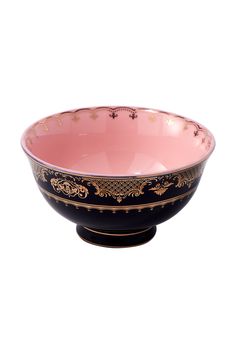 a black and pink bowl with gold trimmings on the rim, sitting in front of a white background