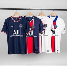 three soccer jerseys hanging on a clothes line