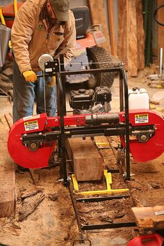 a man working on a machine in a garage