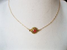 Gorgeous ruby color seeps through the filigree exterior Gives off a medieval look Wear alone or with the matching bracelet ! https://www.etsy.com/listing/482249305/dragons-blood-bracelet-medieval-bracelet?ref=shop_home_active_1 Choose chain length at checkout Gothic Filigree Necklaces For Gifts, Gothic Gold Necklace For Gift, Gold Gothic Necklace For Gift, Red Brass Round Pendant Jewelry, Dainty Metal Choker As A Gift, Dainty Metal Choker As Gift, Dainty Metal Choker For Gifts, Dainty Metal Choker For Gift, Red Choker With Adjustable Chain As Gift