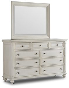 a white dresser with a mirror on top of it and drawers below the dresser is shown