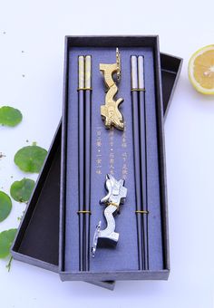 PRICES MAY VARY. ❤ Safe and healthy: Traditional Chinese dragon chopsticks are delicate chopsticks that can only be used by China's supreme emperor. They are made of high-quality heat-resistant fiberglass material. Safe and hygienic, it comes with two dragon-shaped chopstick rests made of zinc alloy material ❤Easy to use: Chinese traditional standard length: 9.4 inches/24 cm, light weight, only 30 grams. The chopstick head is designed with a frosted structure, which will not slide when grasping Chinese Souvenirs, Luxury Chopsticks, Chinese Gift Ideas, Chinese Items, Chinese Luxury, Chinese Chopsticks, Japanese Food Sushi, Souvenir Wedding, Chinese Gifts