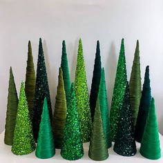 there are many small trees made out of paper