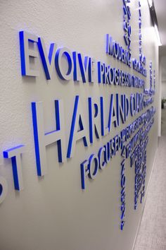 the words on the wall are made up of blue letters