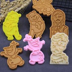 several cookie cutters with cartoon characters on them