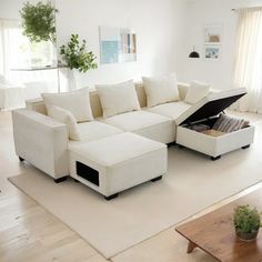 a living room with a sectional couch and coffee table in the corner, open to reveal a storage compartment