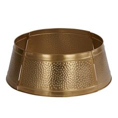 a gold metal bowl on a white background