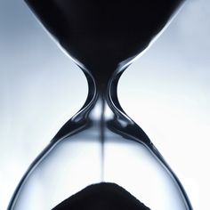 an hourglass with sand running through it