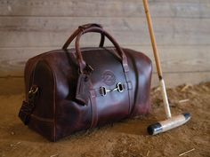 Rugged Leather Duffle Bag, Rugged Distressed Brown Travel Bag, Rustic Waxed Finish Travel Bag, Rugged Oiled Leather Travel Satchel, Rustic Satchel For Travel, Rustic Travel Satchel Bag, Rugged Duffle Bag With Leather Handles, Rugged Rectangular Travel Bag, Horse Bits