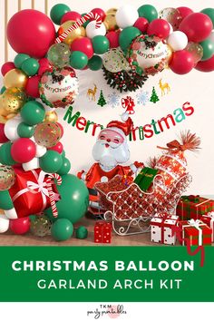 christmas balloon garland kit with santa in sleigh and presents on the table next to it