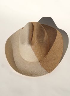 We teamed up with woman ran UNSECO protected artisans in Ecuador, the original origin of the Panama hat. Together we created a two toned western cowboy hat, with the classic panama technique. Handcrafted out of 100% natural toquilla straw. Natural coloring on the left side, toasted toquilla on the right. A cattleman crown measuring 12cm & brim at 9cm. This hat celebrates & honors indigenous women who weave the Panama hat. An art & craft that has been passed down among generation. Adjustable- Vel Handwoven Fedora Hats For Rodeo, Handwoven Fedora For Rodeo, Western Style Handwoven Panama Hat With Short Brim, Western Handwoven Panama Hat For Rodeo, Western Style Handwoven Panama Hat For Rodeo, Handwoven Brimmed Panama Hat For Rodeo, Western Style Handwoven Panama Hat With Curved Brim, Cream Panama Hat For Summer Ranch, Western Style Handwoven Fedora With Flat Brim