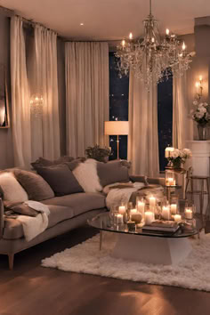 a living room filled with furniture and candles