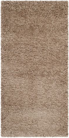 a beige rug with shaggy edges