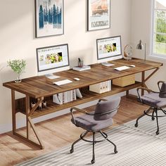 two computer desks sitting on top of a hard wood floor