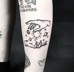 a person's leg with tattoos on it and an image of a woman holding a dog