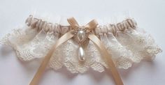 Lace Garter and Satin Band Toss Wedding Garter in Ivory Lace Elegant Lace Bridal Accessories For Bridal Shower, Fitted Cream Lace For Wedding Night, Fitted Delicate Cream Lace, Delicate Fitted Cream Lace, Cream Fitted Delicate Lace, Cream Lace Bridal Accessories For Party, Elegant Fitted Lace Bridal Accessories, Beige Wedding Lace With Lace Trim, Elegant Bridal Accessories With Lace Trim For Party