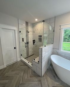 a bathroom with a tub, sink and shower in it's own home area