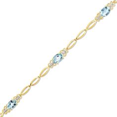 Dress her wrist in elegant beauty. Graceful in 10K gold, delicate open links connect the sparkling aquamarines featured in this stunning fashion bracelet. Feminine and oh-so-precious butterflies adorn both sides of each brilliantly shimmering 6.0 x 4.0mm oval aquamarine. A lovely surprise for the March-born birthday girl, this 7.0-inch bracelet secures with a lobster claw clasp. March Stone, I Am The Queen, Aqua Marina, Treasure Chests, Elegant Beauty, Bring Good Luck, Local Jewelry, Wedding Fun, Aquamarine Stone