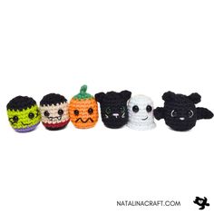 small crocheted pumpkins with faces are lined up in a row on a white background