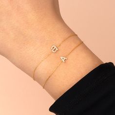 Strike a dazzling tone in your personal style with Adina Eden's Diamond Lowercase Initial Bracelet, featuring a diamond-adorned upper-case letter pendant set into a delicate chain. Expertly crafted in 14K gold, 14K white gold or 14K rose gold, this gem is the personalized touch your everyday 14K bracelet needs. Pair it with a cute midi dress and a diamond bracelet for the full effect. Product Details 14K Gold, 14K White Gold & 14K Rose Gold Diamond Color: H-I Diamond Clarity: I-1 18 Round Brilli Yellow Gold Cubic Zirconia Name Bracelet As Gift, Gift 14k Gold Diamond Bracelet With Accents, Personalized Dainty Yellow Gold Diamond Bracelet, Gift 14k White Gold Diamond Bracelet, Gift White Gold 14k Diamond Bracelet, Gift Diamond Bracelet With Accents In 14k Gold, 14k Gold Diamond Bracelet As Gift, 14k Gold Diamond Bracelet With Accents As Gift, 14k Gold Chain Bracelet With Single Cut Diamonds