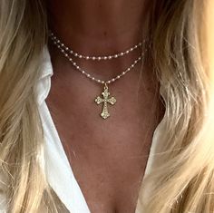 "This is made out of tiny cream glass pearls and has a little gold medal  cross with tiny beads, it is 30-33 inches long. You can also wear as a layered necklace The cross is almost 1 1/4\" long and 3/4\" wide" Beaded Necklace With Cross, Layer Cross Necklace, Pearl And Cross Necklace, Cross Pearl Necklace, Pearl Necklace Layered, Wooden Cross Necklace, Long Cross Necklace, Beaded Cross Necklace, Layered Cross Necklace