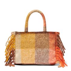 Colette handbagFringes on the sidesDetachable shoulder strapLogo embroidered on the frontOrange and brown all over patternSoft and woolly fabricSizes: 30cm X 22cm X 12cm Multicolor Shoulder Bag For Shopping In Fall, Multicolor Shoulder Bag For Fall Shopping, Fall Multicolor Shoulder Bag For Shopping, Rectangular Bags With Tassels For Fall, Fall Rectangular Bag With Tassels, Rectangular Fall Bag With Tassels, Wool Travel Bags For Fall, Rectangular Wool Bag For Fall, Wool Rectangular Bag For Fall