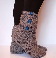 These slipper boots are so amazingly comfortable, you'll never want to take them off!! Great for wearing around the home or office, these slippers are cozy enough to wear all day long. Perfect for those chilly floors :) Thick and chunky they are sure to warm your feet! Soft and comfortable they are sure to put your toes in heaven! Cables and buttons they are super stylish and sleek! Buttons will vary depending on the order but all buttons will match the slippers perfectly. See my other booties/s Cozy Chunky Knit Socks With Round Toe, Cozy Chunky Knit Socks, Cozy Knitted Yarn Socks, Comfortable Crochet Knitting Pattern For Winter, Women Socks Fashion, Grey Slippers, Knitted Booties, Crochet Booties, Knitted Socks