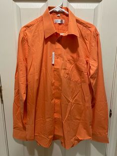 New Men’s Covona Long Sleeve Button Up Dress Shirt Spring Orange Large 16 36-37 EXACT ITEM IS PICTURED ABOVE. FREE SHIPPING IN THE 50 STATES! DELIVERY CONFIRMATION IS ALWAYS INCLUDED! WE SHIP ALL ITEMS WITHIN 1 BUSINESS DAY. WE DO NOT SHIP ON WEEKENDS OR HOLIDAYS WHEN THE POST OFFICE IS CLOSED. WE OFFER RETURNS ON MOST ITEMS. PLEASE VIEW OUR RETURN POLICY PRIOR TO PURCHASING. WE DO NOT CANCEL PURCHASES FOR ANY REASON  _gsrx_vers_795 (GS 7.0.7 (795)) Orange Button Up, Spring Orange, Long Sleeve Button Up Dress, The 50 States, Button Up Dress, Spring Shirts, 50 States, New Man, Post Office