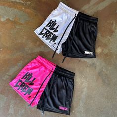 three pairs of shorts with the words hell crew printed on them, all in black and pink