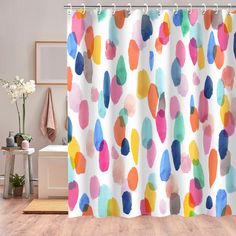 a shower curtain with multicolored circles on it