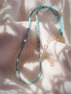 A dainty jewelry design for appeasing the star within, this adjustable gold-filled choker necklace comes beaded with tiny beads carved from all natural turquoise gemstone.✦ DETAILS ✦✧ Name: Hōkūala (ho koo AH laa) - rising star.✧ Adjustable Length from: 14.5"-17".✧ Genuine 2.5mm faceted Turquoise Beads.✧ 14kt Gold Filled Components, Extender, and Clasp.✧ All Ke Aloha Jewelry pieces come packaged thoughtfully, beautifully, and ready for gift giving.✧ Unless otherwise noted in the listing descript Adjustable 14k Gold Filled Tiny Beaded Necklace, Adjustable 14k Gold-filled Tiny Beads Necklace, Adjustable 14k Gold-filled Beaded Necklace With Tiny Beads, Bohemian 14k Gold-filled Beaded Necklaces, Dainty Turquoise Beaded Necklace With Tiny Beads, Adjustable Turquoise Choker With Tiny Beads, Adjustable Turquoise Beaded Choker, Adjustable Turquoise Beaded Amazonite Necklaces, Handmade Adjustable 14k Gold Filled Beaded Necklace