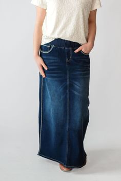 Every modest wardrobe deserves a maxi denim skirt and we're excited to offer the Arabella in sizes XS-5XL so all women have options! Crafted of soft and stretchy denim fabric, this skirt features a non-bulky elastic waist, four functional pockets, only light vintage fading and top-stitching details on back pockets and seams. Style this maxi denim with a range of tops or sweaters and wear for everything from a brisk morning walk to frosting cupcakes for a bake sale. Fit: Check the size charts. Some people prefer sizing up. Style: maxi denim skirt with elastic waist, functional pockets and top-stitching detail Color: medium wash denim Fabric content: 75% cotton 23% polyester 2% spandex Care instructions: wash gentle cycle, cold; lay flat to dry, cool iron if needed. For best results, always Frosting Cupcakes, Maxi Denim Skirt, Modest Wardrobe, Be Intentional, Morning Walk, Stitching Details, Modest Clothing, Denim Maxi Skirt, Garment Labels