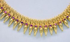 "Vintage 22 karat solid gold spiky design necklace(champakalee har) with earring pair from rajasthan india. made of solid 22 karat gold and sated ruby color stones. full handcrafted great piece for your jewelry collection. buyer will get gold test report for this item for free. total weight of set-66 grams(2.31 ounce), total lenght of necklace-18\"(we can adjust length),width of necklace-1\",material -solid 22 karat gold." Hallmarked 22k Gold Jewelry For Festivals, Hand Set 22k Gold Round Temple Necklace, Formal Temple Jewelry Necklace Hand-set, Handmade Yellow Gold Temple Jewelry, Antique Heavy Yellow Gold Jewelry, 22k Yellow Gold Temple Jewelry, Handmade Temple Jewelry In Yellow Gold, 22k Gold Temple Necklace For Formal Festivals, 22k Gold Temple Jewelry For Formal Occasions