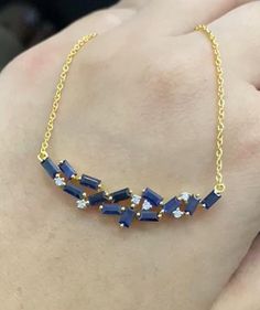 Discover the epitome of grace with our exquisite Blue Sapphire Necklace, meticulously crafted to add a touch of sophistication to any ensemble. This luxurious piece features real diamonds set in your choice of 10k, 14k, or 18k  in Rose Gold, Yellow Gold, or White Gold. Key Features: Authentic Blue Sapphires: Offering deep, rich hues for an eye-catching sparkle. Genuine Diamonds: Providing a brilliant contrast to the sapphire's elegance. Gold Options: Available in 10k, 14k, or 18k Rose Gold, Yell 14k Gold Blue Jewelry With Diamond Accents, 14k Gold Jewelry With Diamond Accents In Blue, 14k Gold Jewelry With Blue Diamond Accents, Blue Baguette Diamond Jewelry For Anniversary, Yellow Gold Sapphire Jewelry With Baguette Diamonds, 14k Gold Blue Diamond Cut Jewelry, Sapphire Jewelry With Baguette Diamonds, Blue Diamond Jewelry With Baguette Diamonds, Fine Jewelry With Blue Baguette Diamonds