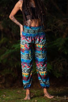 These tribal, bohemian-style pants are super soft and comfy! If your wish is freedom, your wish is these pants command! The Tribal Yoga Ali Baba Pants are light and breathable so they are ideal for yoga. They have elastic ends so they can be shortened for extra styling. In these pants, you can jump, twist, bounce, and be wild! CHECK THIS VIDEO OF A YOGA SESSION WITH THE PANTS : https://www.instagram.com/p/BPG46ZigA-P/ Material : 100% CottonMEASUREMENTS :Length:38.5 inches / 98cmWaist: 23.5 inche Stretch Harem Pants For Festivals, Casual Harem Yoga Pants For Festival, Stretch Hippie Pants For Festivals, Hippie Ankle-length Pants With Elastic Waistband, Casual Boho Print Pants For Festivals, Casual Boho Print Festival Pants, Multicolor Bohemian Pants With Boho Print, Multicolor Stretch Yoga Pants For Festivals, Stretch Harem Pants With Elastic Waistband For Festival