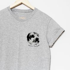 a gray t - shirt with the moon on it