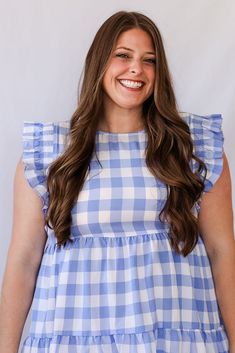 The Blue Skies Gingham Ruffle Sleeve Mini Dress is what Spring and Summer dreams are made of. This dress is so flattering and perfectly light weight for the warmer months. This dress features a high neck, small key hole back, fun ruffle details on the sleeves and a tiered bottom. The oversized gingham print is absolutely adorable and the dreamiest shade of blue. Pair this with gold jewelry and sandals for an adorable outfit! - Ruffle sleeves - Blue gingham print - Tiered bottom - Light weight mi Gingham Plaid Dress With Ruffles For Day Out, Gingham Plaid Dress With Ruffles For Brunch, Chic Plaid Dress With Ruffles For Spring, Blue Plaid Ruffle Dress For Spring, Blue Plaid Dress With Ruffles For Spring, Cute Ruffled Plaid Dress For Spring, Blue Casual Plaid Dress With Ruffles, Bottom Light, Favorite Daughter