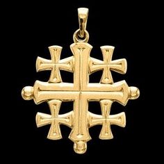 a gold cross pendant with four crosses on it's sides and two smaller crosses in the center