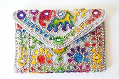 silvery bag with multicolored embroidered elephant Traditional Summer Party Bags, Silver Embroidered Bags As Gift, Silver Embroidered Bag For Gift, Silver Embroidered Bags Suitable For Gifts, Silver Embroidered Clutch Bag, Silver Rectangular Shoulder Bag For Summer, Silver Rectangular Bag For Festivals, Silver Rectangular Bags For Festivals, Rattan Light Fixture