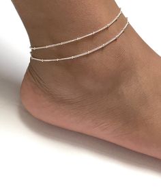 "Sterling Silver Adjustable Satellite Chain Anklet Double Layered Ankle Bracelet Minimalist and Dainty Ankle Bracelet Metal: All Components Are Made From Solid .925 Sterling Silver **Choose Size At Checkout** *Adjustable from 8\" to 9\" *Adjustable from 9\" to 10\" *Adjustable from 10\" to 11\" Please Read Store Policy Before Purchase You can find more anklets in my store here: https://www.etsy.com/shop/LinksAndStones?ref=simple-shop-header-name&listing_id=687470766&section_id=26197034 T Elegant Summer Anklets With Round Beads, Dainty Beaded Chain Anklets With Round Beads, Minimalist Anklets For Gift, Elegant Adjustable Anklet With Tiny Beads, Silver Anklets With Tiny Beads For Summer, Minimalist Anklets With Round Beads For Gift, Minimalist Round Bead Anklets As Gift, Elegant Silver Anklets With Tiny Beads, Summer Gift Beaded Chain Anklets