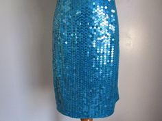 "This is a Stunning Vintage by Designer NITELINE Blue Green Teal Mermaid Sequin Square Neckline Sleeveless Evening Party Dress Size 8 S-M All measurements are approximate: Armpit to armpit 16\" length 36\" ( from shoulder to hem) This fabulous mini dress is in very good vintage condition with very little sign of wear, and ready to wear. Material: 100% Polyester, Sequins For more beautiful and fabulous of vintage Dresses Handbags and Accessories please see our \"Handbags Accessories clothing\" Sh Blue Sequined Mermaid Dress For Night Out, Blue Sleeveless Dress For Costume Party, Blue Mermaid Hem Dress For Party Season, Spring Party Sleeveless Mermaid Dress, Blue Mermaid Evening Dress For Summer, Blue Mermaid Dresses For Party Season, Blue Fitted Mermaid Dress For Party, Blue Sleeveless Mermaid Dress, Blue Sequined Mermaid Dress