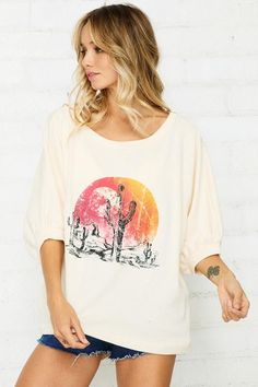 Add some desert vibes to your summer collection with this front screen print French-terry pullover with half sleeve, featured in an oversized fit. -Color: Cream -Lightweight French-terry fabric -Banded cuff and neckline -Raw edge and rounded shirttail hemline -Oversized fit -Content: 85% Cotton 15% Polyester -Hand wash/ Line dry -Made in the USA -Model is wearing a size Small Trendy Short Sleeve Sweatshirt For Spring, Summer Casual Sweatshirt For Loungewear, Casual Summer Loungewear Sweatshirt, Casual 3/4 Sleeve Summer T-shirt, Trendy Cotton T-shirt With 3/4 Sleeves, Oversized Casual T-shirt With 3/4 Sleeves, Trendy 3/4 Sleeve Cotton T-shirt, Trendy T-shirt With 3/4 Sleeves For Spring, Summer Short Sleeve Relaxed Fit Sweatshirt