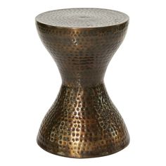 a small metal table with holes on the top and bottom, sitting in front of a white background