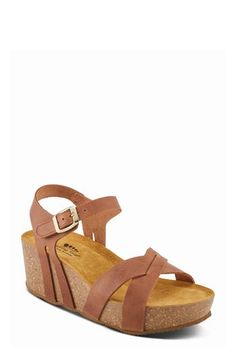 A cork-wrapped platform and chunky wedge heel elevate a weekend-ready leather sandal fitted with an adjustable strap at the ankle. 1 3/4" heel; 1 1/4" platform Adjustable ankle strap with hook-and-loop closure Molded footbed Leather upper and lining/synthetic sole Made in Spain Casual Platform Sandals With Cork Material, Casual Cork Platform Sandals, Casual Cork Platform Wedge Sandals, Adjustable Round Toe Wedge Sandals With Cork-bed Midsoles, Cork Wedge Sandals With Heel Strap, Open Toe Cork Wedge Sandals With Heel Strap, Cork Sandals With Heel Strap And Wedge Heel, Platform Sandals With Cork And Round Toe, Cork Platform Sandals With Round Toe